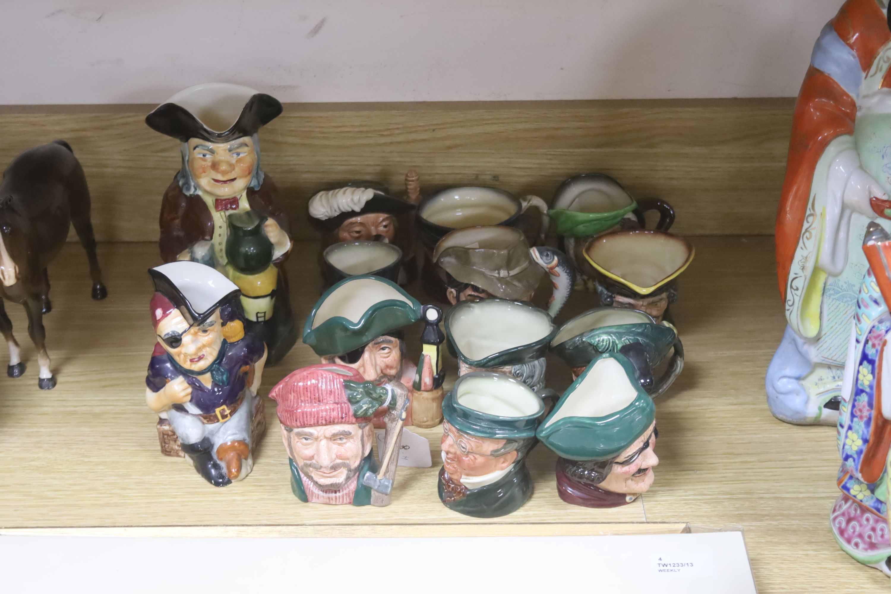 Twelve Royal Doulton character 'small' mugs and two Toby jugs